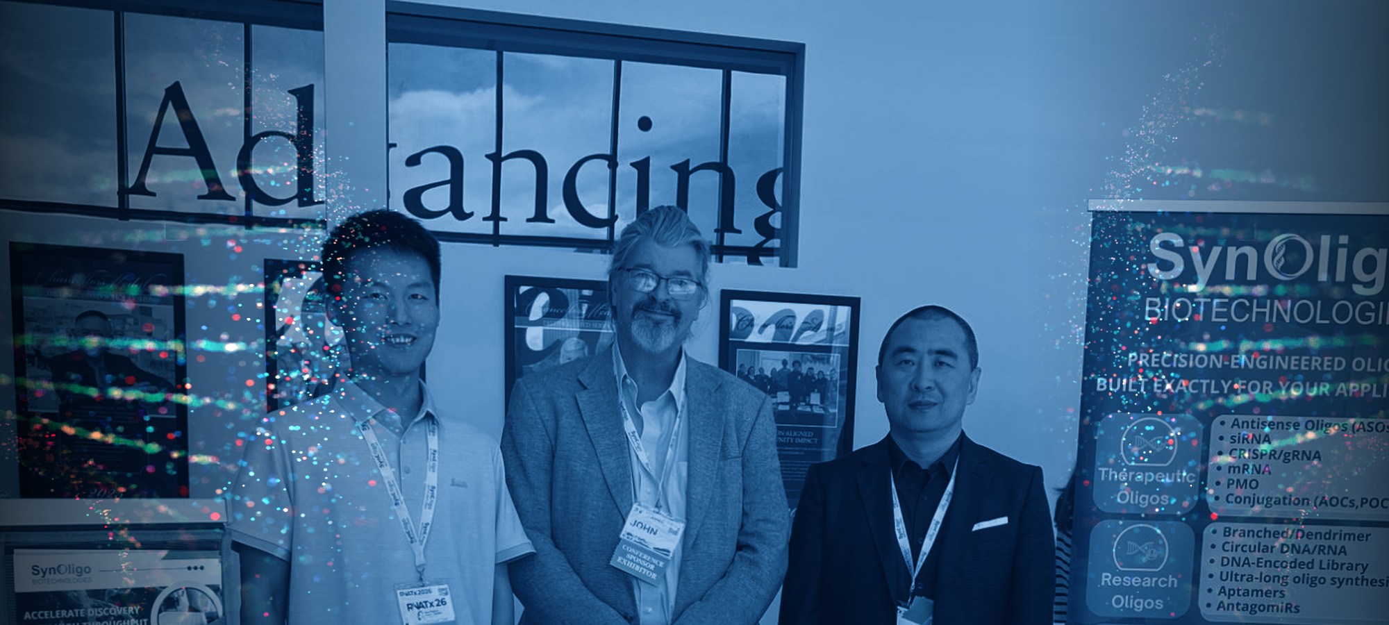 Three members of the Synoligo Biotechnologies team at their conference booth